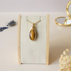 Pendentif oeil de tigre 4,4cm wire wrapping doré