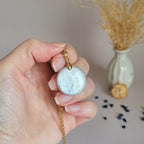 Pendentif en pierre de lune ronde 2,5 cm bélière dorée