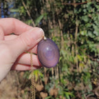 Vidéo rotation pendentif obsidienne œil céleste montrant couches et reflets violets